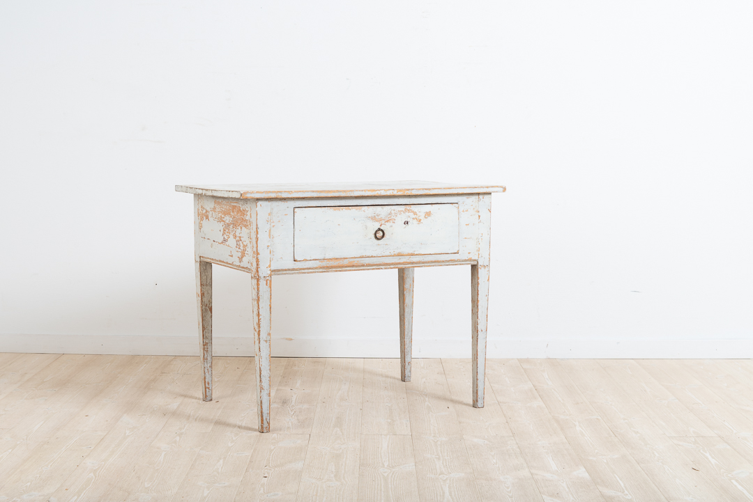 Provincial gustavian coffee table / side table from northern Sweden. Dry scraped to the original first layer of paint. Straight legs with a large drawer. Healthy and solid frame. Manufactured during the late 18th century.