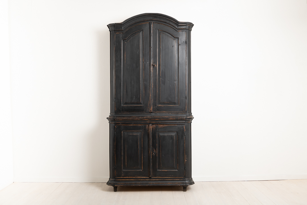 Rococo cabinet in two parts from northern Sweden. Manufactured around 1790 to 1800. The paint is later. Lock and key in working condition