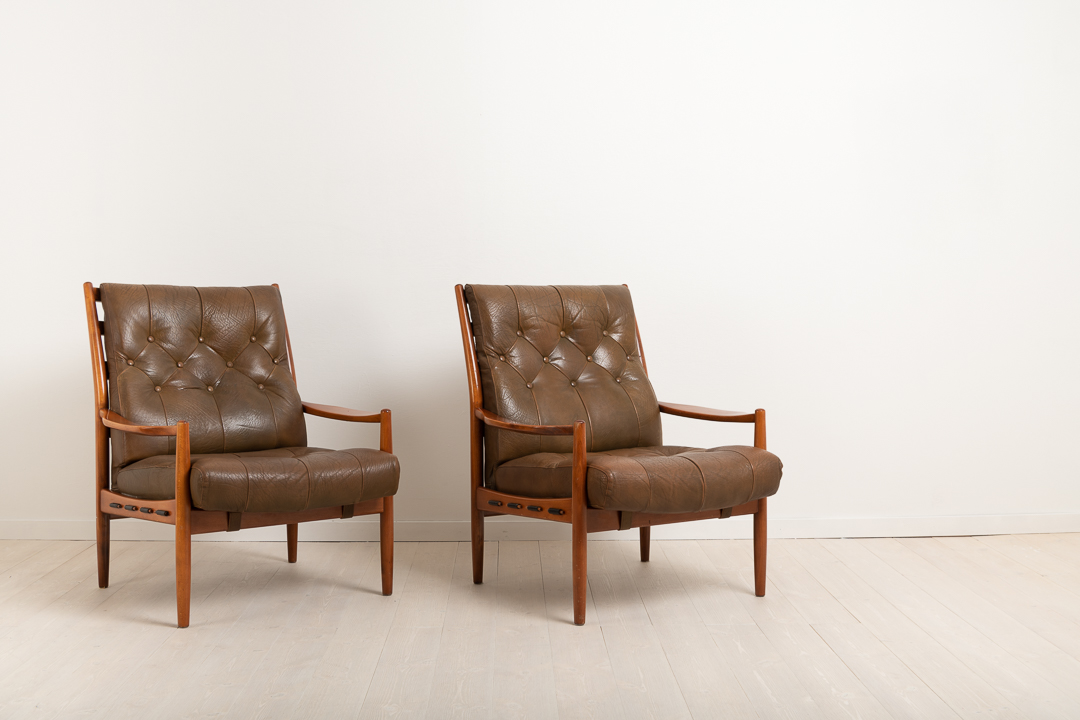 INGEMAR THILLMARK  'Läckö Hög' pair of armchairs. OPE from the 1960s. Frame made from stained beech. Deep padded seats dressed with leather.