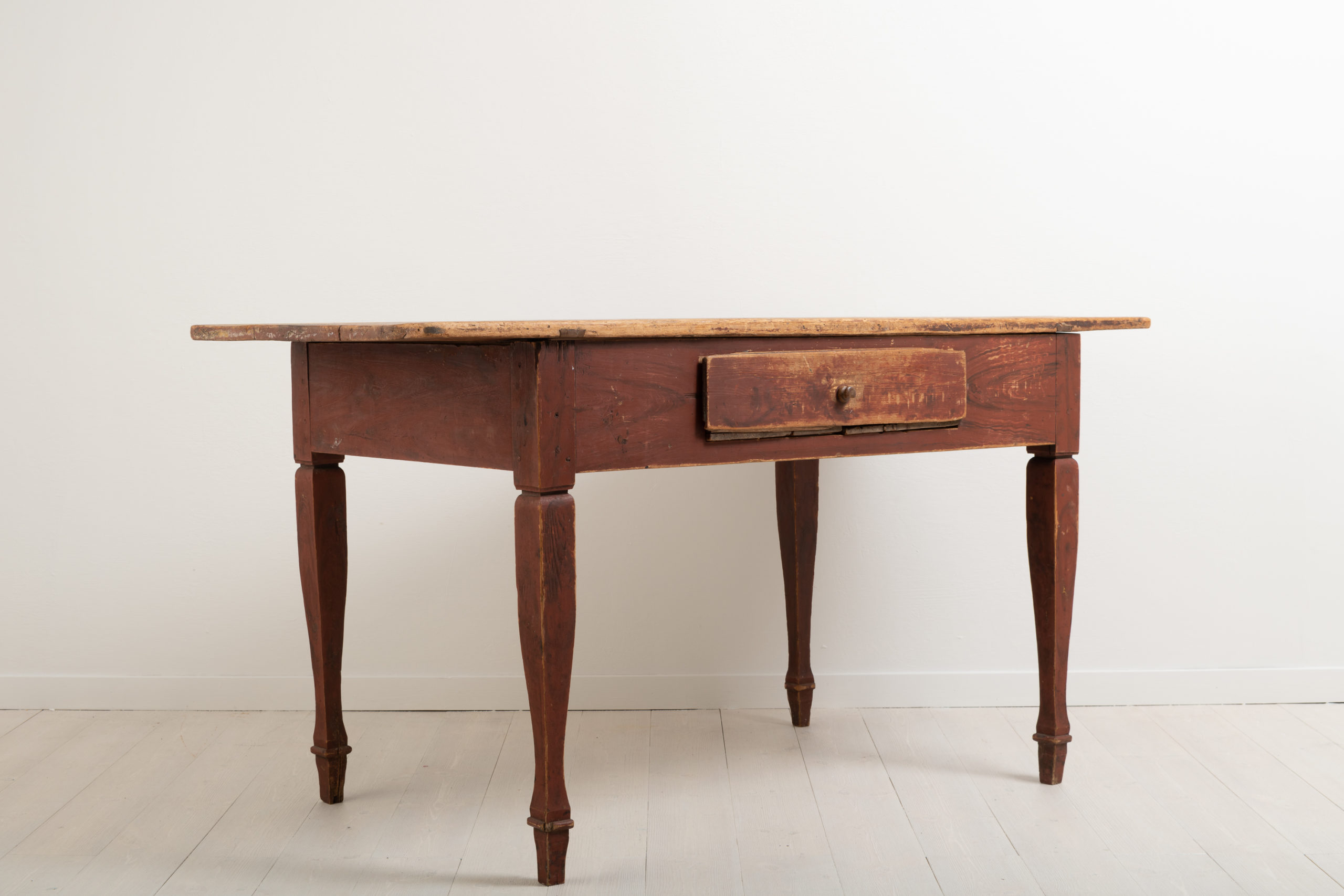 Gustavian styled work table from the late 18th century. Made in northern Sweden in the province Norrbotten. Original wooden knobs.