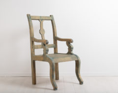 Folk art armchair from northern Sweden. The chair has traces of the original paint. Manufactured around 1870