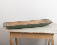 Unusually long trough with traces of the original green paint underneath. Marked with a house mark underneath and along one side. Northern Sweden 1860.