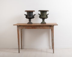 Swedish side table from around the year 1800. Made in northern Sweden with traces of the original paint. Gustavian style with straight tapered legs. Great patina. Height to rim is 61 cm.