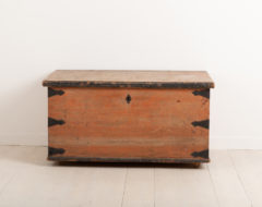 Folk art chest in painted pine. The chest has enforcements in hand wrought iron around the corners and back. Untouched original condition and paint