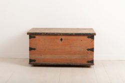 Folk art chest in painted pine. The chest has enforcements in hand wrought iron around the corners and back. Untouched original condition and paint