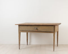 Provincial neoclassical table in painted pine. The table is folk art and primitive with straight legs and a single large drawer. Untouched original condition