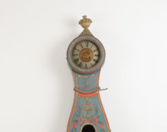 Long case clock from Ljusdal in the province Hälsingland in central Sweden. The case is curved with a rococo shape and decorated with a carved wooden decor
