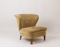 Gösta Jonsson easy chair from the mid 1900s. The chair is Scandinavian modern with the original striped velour upholstery. Made during the 1940s to 1950s in Sweden