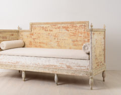 Gustavian sofa in painted pine. It has the original paint with natural distress and wear due to time. Hand carved wooden decor