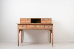 Unusual neoclassical writing table with a top gallery with drawers on each side. The table is made in northern Sweden around 1790 which is during the Swedish gustavian era.