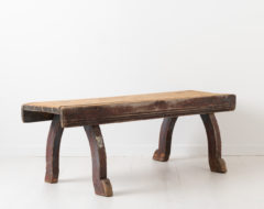 Late 18th century bench in folk art from northern Sweden. The bench is primitive and rustic with original distressed paint and authentic patina