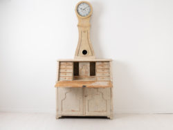Antique clock secretary from northern Sweden. The clock is from around 1820 and dry scraped to the original light paint. Height to writers top is 70 cm