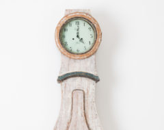 Swedish long case clock made in painted pine from around 1820. The clock has a typical rococo shape with a solid frame and heathy wood