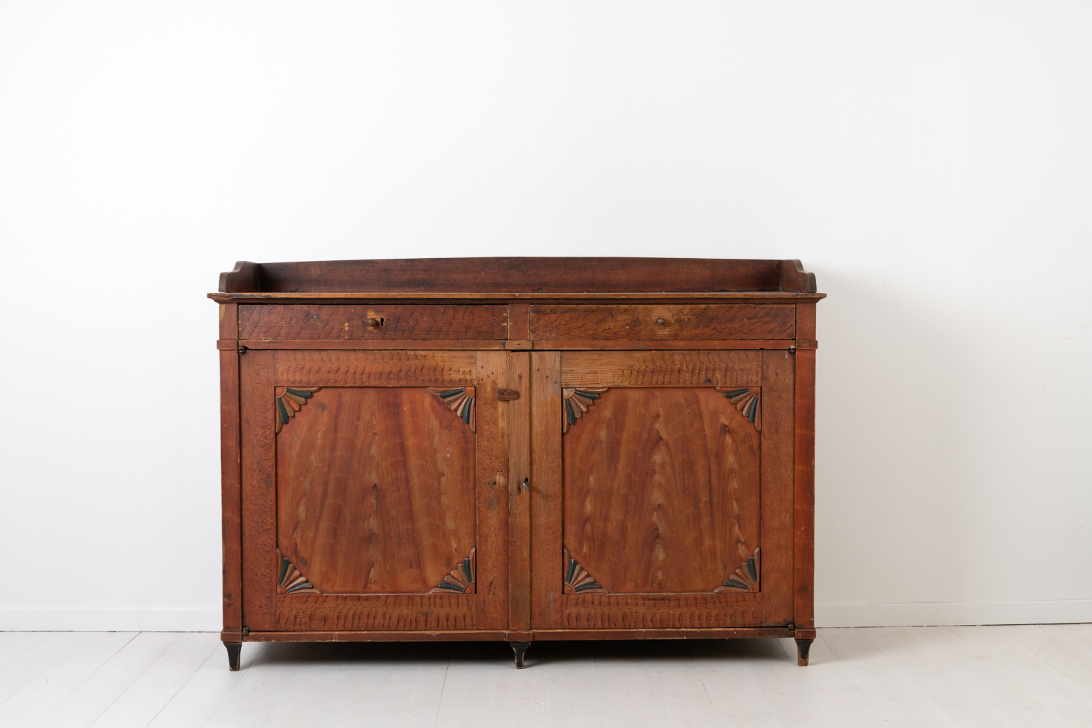 Low red gustavian sideboard from Northern Sweden. The sideboard is from the early 19th century, around 1810 to 1820, and is unusually low and wide