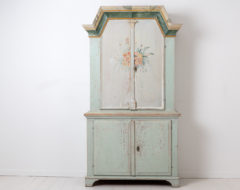 Swedish country furniture cabinet dated 1845 and monogrammed on the doors. Painted pine with the original white / light grey and green paint.