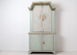 Swedish country furniture cabinet dated 1845 and monogrammed on the doors. Painted pine with the original white / light grey and green paint.