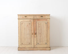 Late gustavian Swedish sideboard made during the end of the gustavian period around 1800 to 1810. The sideboard is pine and hand scraped to original paint