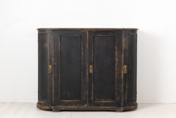 Black Swedish curved sideboard in gustavian style from the 1820s to 1840s. The sideboard has four doors, healthy and solid frame.
