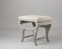 Light Swedish empire stool from around 1820. The paint is later and the stool has a renovated seat upholstered in linen fabric.
