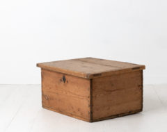 Swedish chest or box in pine. Never painted with smaller details in iron, such as the hinges which extends up the lid