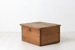Swedish chest or box in pine. Never painted with smaller details in iron, such as the hinges which extends up the lid