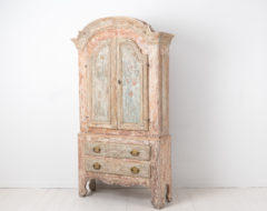 Late 1700s rococo cabinet from Jämtland in northern Sweden. The cabinet is a country furniture with traces of the original paint
