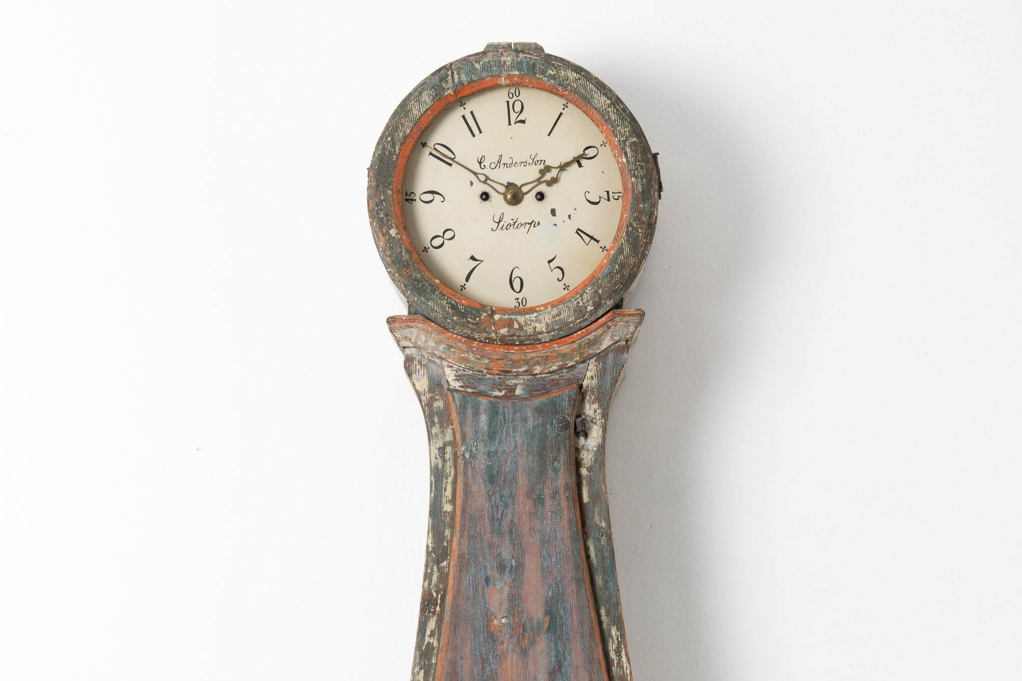 Swedish long case clock from the 1820s to 1840s. The clock has a rococo shape with the original blue green paint and case in pine