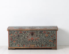Folk art pine chest from Northern Sweden made during the early 1800s. The chest is very elaborately decorated with many coloured flowers on a blue base