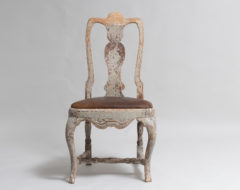 Swedish late baroque chair made around 1760 to 1770. The chair has traces of the original paint as well as a time worn authentic patina.