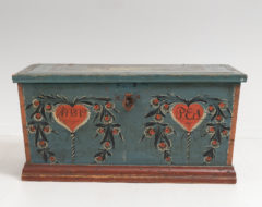 Blue and red painted chest from Delsbo in Hälsingland, Sweden. The chest is pine and likely painted for a wedding. Dated 1819 and monogrammed PES