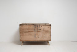 Primitive antique storage chest or box from northern Sweden made around 1810 to 1820. Handmade in wood bare pine with storage underneath the lid