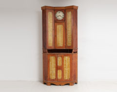Corner clock bureau cabinet from Northern Sweden made circa 1820. This country house furniture is in two parts and made specifically to be placed in corner