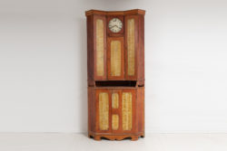 Corner clock bureau cabinet from Northern Sweden made circa 1820. This country house furniture is in two parts and made specifically to be placed in corner