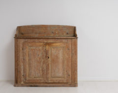 Country house rococo sideboard from northern Sweden made during the late 1700s. The sideboard is pine with traces of the original paint