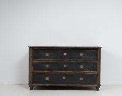 Unusually large gustavian chest of drawers in painted pine. The chest has slanted corners with flutes and the table top has profiled edges.