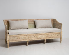 Rare Swedish gustavian sofa from the late 1700s. The sofa is a so called trågsoffa and is solid pine with scraped to original paint.