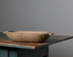 Oblong wood bowl with handles on the sides. Made during the mid 1800s in Northern Sweden. The bowl is in good antique condition consistent