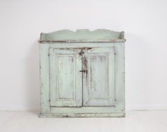 Rustic country home sideboard made in Northern Sweden around 1830 to 1840. Made in painted pine with a secondary paint from the late 1800s