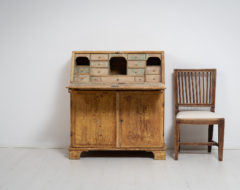 Swedish country secretary desk made around 1810 to 1820. The secretary is a northern Swedish country house furniture handmade in solid pine