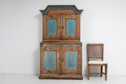 Rare country home cabinet in baroque style from Northern Sweden made during the first years of the 1800s. The cabinet is handmade and in two parts