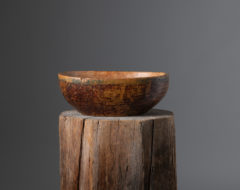 Mid-19th century wood bowl from northern Sweden. The bowl has an organic or oval shape and unusually high sides. It has some marks of use