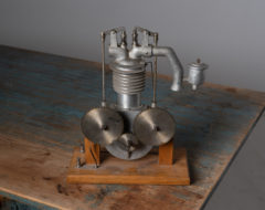 Mid-century modern model of an engine. The engine is a school model demonstrating how a two-stroke engine is constructed and works