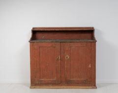 Folk art country sideboard from northern Sweden made during the early 1800s, around 1820 to 1840. The sideboard is painted pine with the original paint