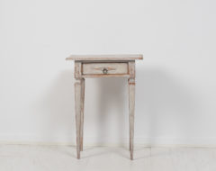 Small neoclassical side table from Sweden made during the late 18th century, around 1790. The table is made in pine with distressed paint