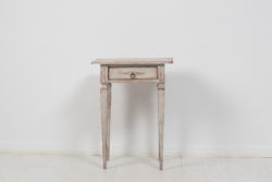 Small neoclassical side table from Sweden made during the late 18th century, around 1790. The table is made in pine with distressed paint