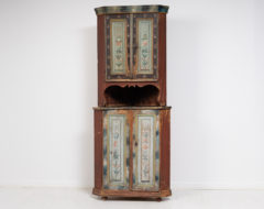 Rare Swedish corner cabinet made during the first years of the 19th century, 1810 to 1820. The cabinet is pine and made in two parts.