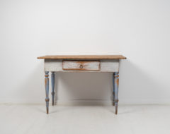 Small folk art table from northern Sweden made around 1850. The table is painted pine with the original first layer of paint that has the authentic patina of time