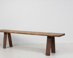 Rustic folk art bench from Sweden made during the early 19th century. The bench is made in Swedish pine which is a particularly dense and hardwearing material