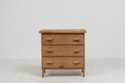 Swedish modern small chest of drawers made during the mid 20th century, 1930 to 1940. The chest is a combination of solid pine and plywood