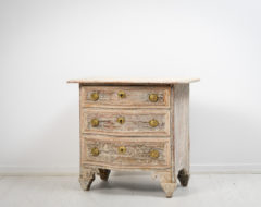 Small unusual baroque bureau from Sweden made during the second half of the 1700s. The bureau has a curved front with three drawers
